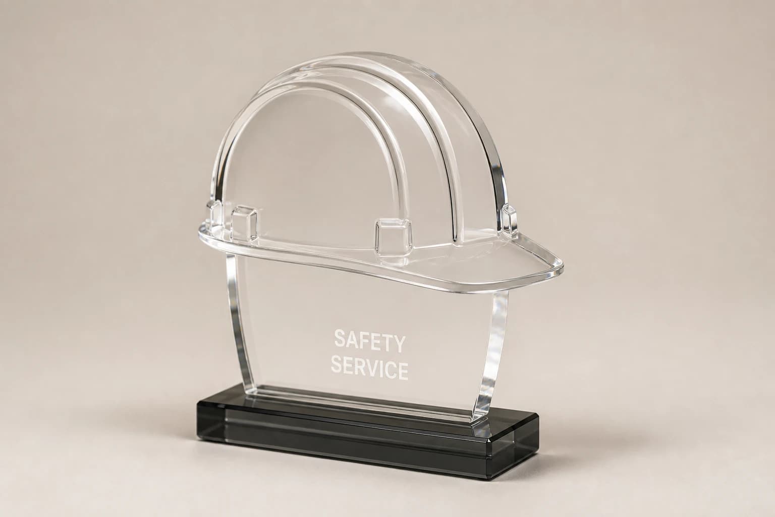 Clear acrylic hard-hat safety award on a charcoal base.